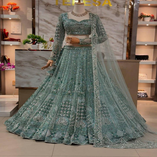 Rama Green Soft Net Wedding Wear Beautiful Lehenga Choli
